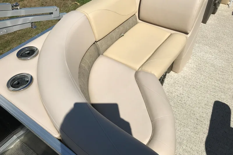 Slide: The Image of 2019 Avalon Venture Fish N Cruise boat with beige seating and cup holders. - 11