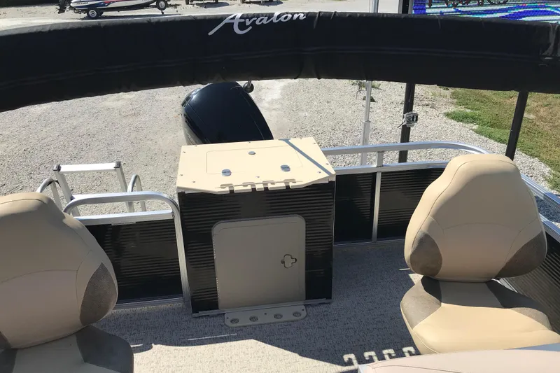 Slide: The Image of 2019 Avalon Venture Fish N Cruise boat interior with seating and storage. - 12