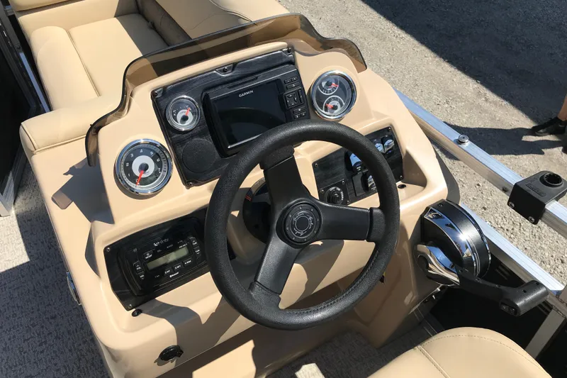 Slide: The Image of 2019 Avalon Venture Fish N Cruise 20' boat dashboard with steering wheel and controls. - 15