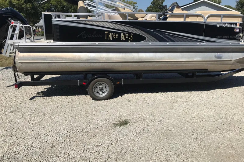 The Image of 2019 Avalon Venture Fish N Cruise 20' pontoon boat on trailer, side view. - 3