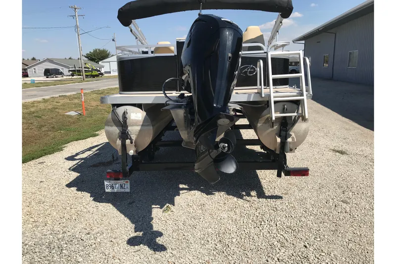 Slide: The Image of 2019 Avalon Venture Fish N Cruise boat with outboard motor on trailer. - 5
