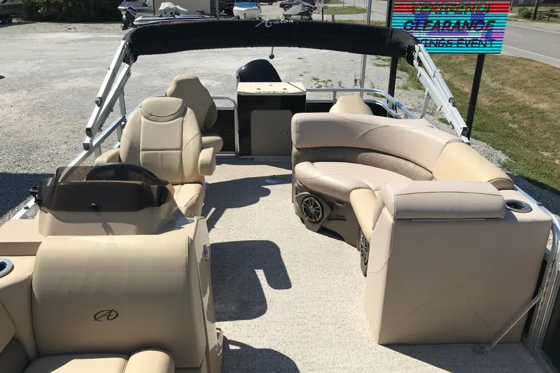 Slide: The Image of 2019 Avalon Venture Fish N Cruise 20' pontoon boat with beige seating and helm. - 7