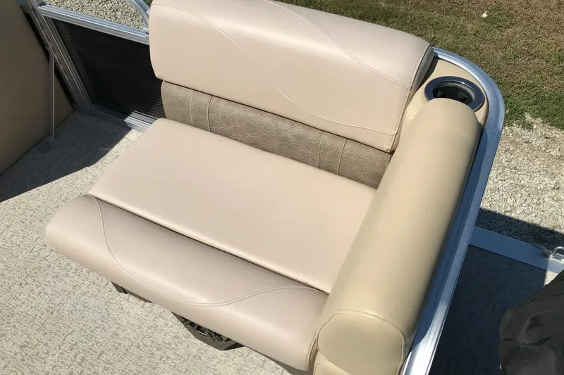 Slide: The Image of Beige seating on 2019 Avalon Venture Fish N Cruise boat, featuring cup holder and textured accents. - 9