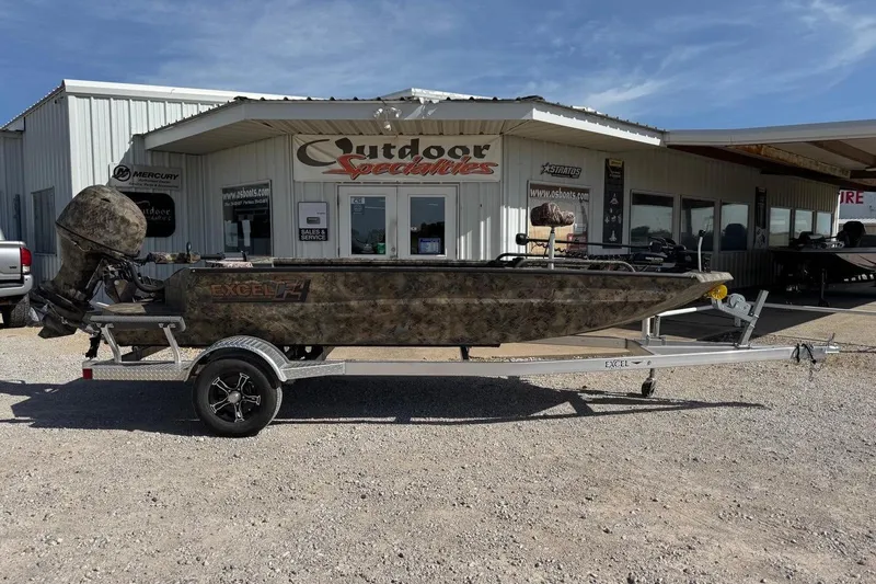 The Image of 2023 Excel 1751V4M boat on trailer outside Outdoor Specialties store. - 1