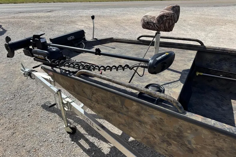 Slide: The Image of 2023 Excel 1751V4M boat with Minn Kota trolling motor on a trailer. - 5