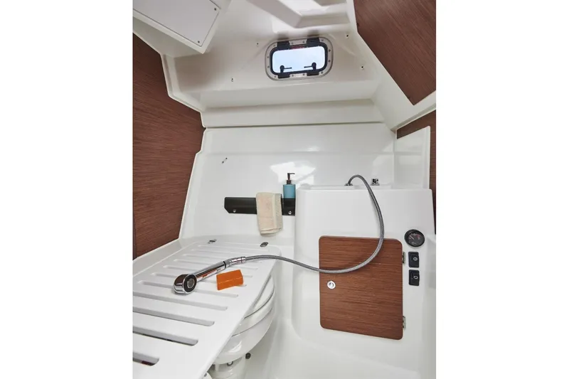 Slide: The Image of 2026 Jeanneau NC 795 Series 2 boat interior with compact bathroom and shower. - 11
