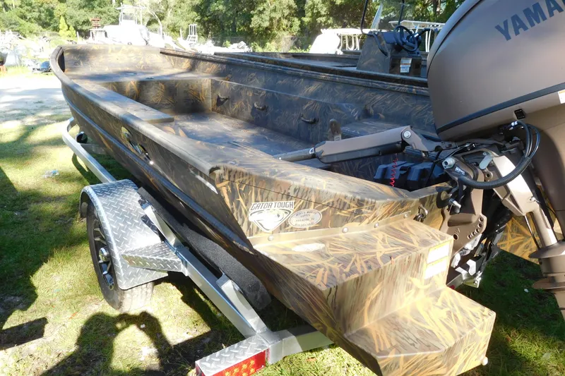 Slide: The Image of 2025 G3 Gator Tough 18 DK boat with Yamaha motor on a trailer. - 2
