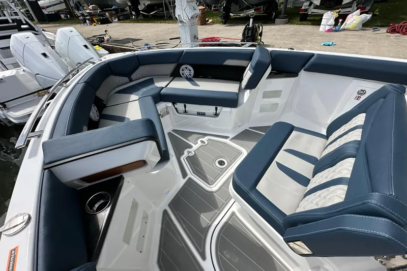 Slide: The Image of Luxurious seating on a 2026 Monterey Elite 30 OB boat, featuring sleek design and modern upholstery. - 12