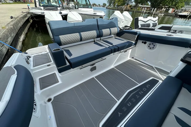 Slide: The Image of 2026 Monterey Elite 30 OB boat interior with luxurious seating and modern design. - 5