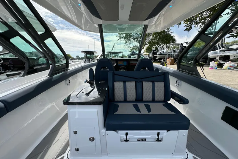 Slide: The Image of 2026 Monterey Elite 30 OB boat interior with luxurious seating and modern design. - 6