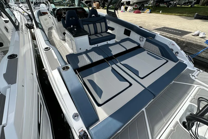 Slide: The Image of 2026 Monterey Elite 30 OB boat with luxurious seating and modern design. - 8