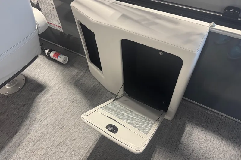 Slide: The Image of Open storage compartment on 2026 Godfrey Sweetwater 2086 CSE boat interior. - 12