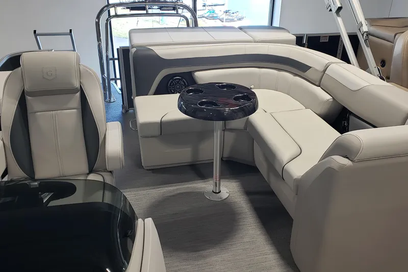 Slide: The Image of Luxurious interior of 2026 Godfrey 2086C SE boat with plush seating and table. - 3