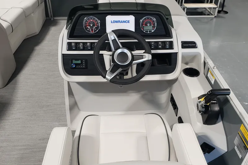 Slide: The Image of Interior of 2026 Godfrey 2086C SE boat with steering wheel and control panel. - 5