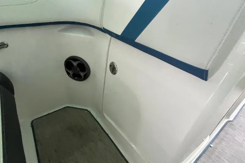 Slide: The Image of Interior of 2016 Regal 22 FasDeck ESX boat with speaker and blue trim. - 10