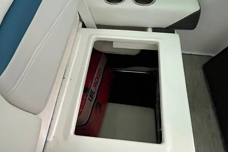 Slide: The Image of Storage compartment with life jacket in 2016 Regal 22 FasDeck ESX boat. - 14