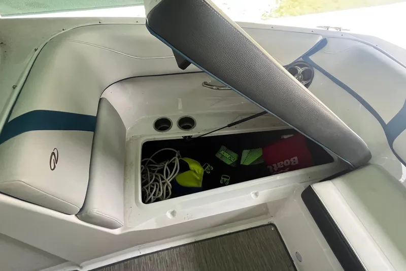 Slide: The Image of 2016 Regal 22 FasDeck ESX boat interior storage compartment with gear and accessories. - 20