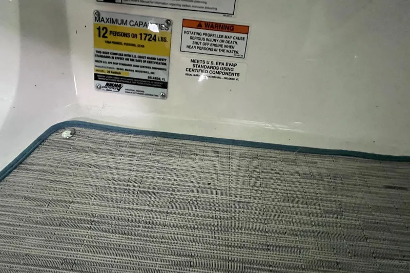 Slide: The Image of 2016 Regal 22 FasDeck ESX capacity warning label, 12 persons or 1724 lbs. - 25