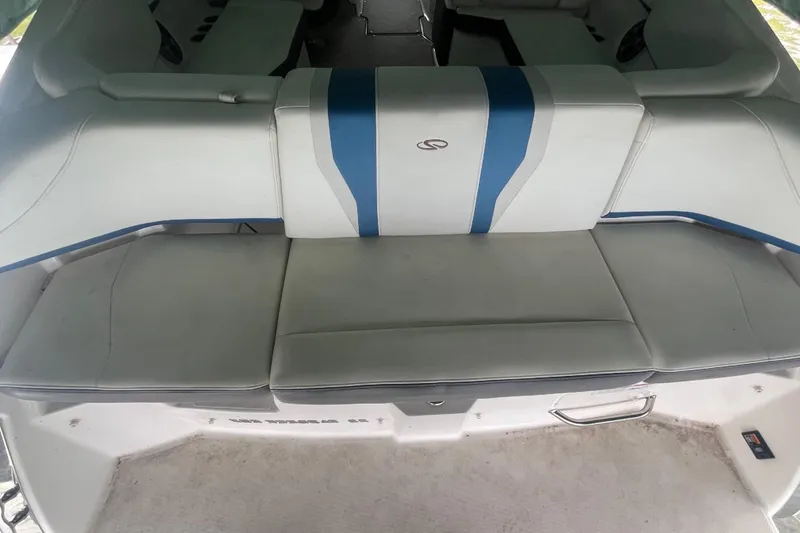 Slide: The Image of 2016 Regal 22 FasDeck ESX boat interior with white and blue seating. - 27