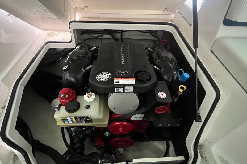 Slide: The Image of Engine compartment of a 2016 Regal 22 FasDeck ESX boat, featuring a Volvo Penta engine. - 29
