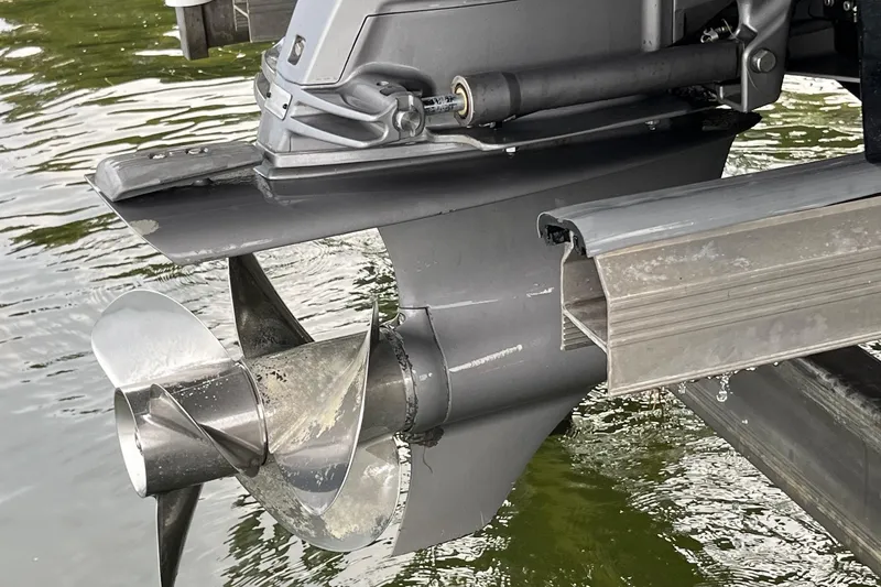 Slide: The Image of Close-up of a 2016 Regal 22 FasDeck ESX boat propeller in water. - 30