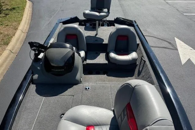 Slide: The Image of 2017 Tracker Pro Team 175 TXW boat interior with seating and steering console. - 2