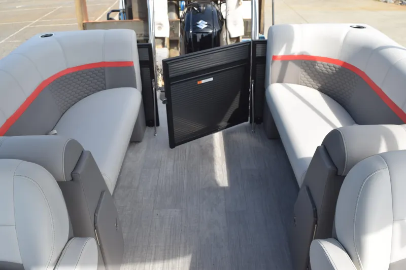 Slide: The Image of 2023 Qwest E Class-820 RLS-Lt pontoon boat interior with gray seating and red accents. - 12