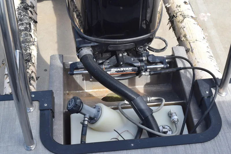 Slide: The Image of 2023 Qwest E Class-820 RLS-Lt boat engine compartment with SeaStar hydraulic steering system. - 16