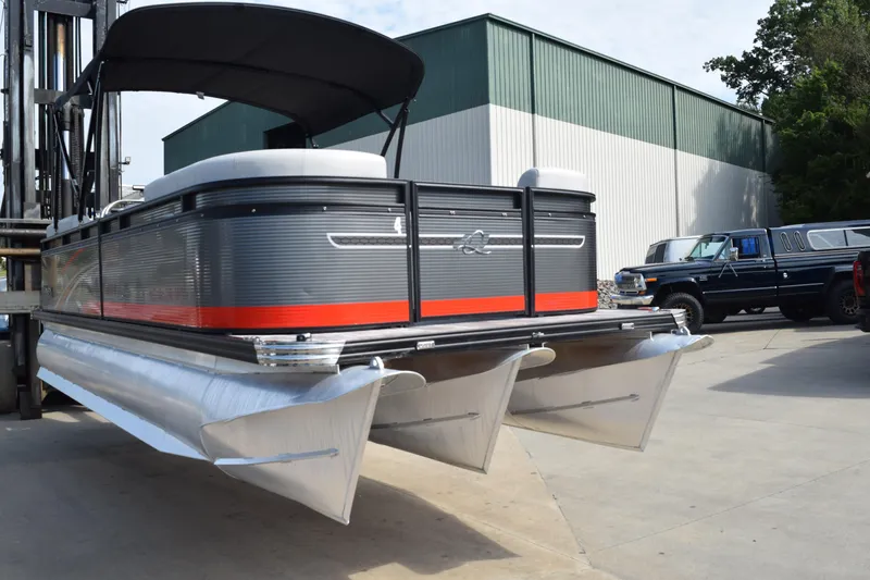 Slide: The Image of 2023 Qwest E Class-820 RLS-Lt pontoon boat on forklift, outdoor storage area. - 3