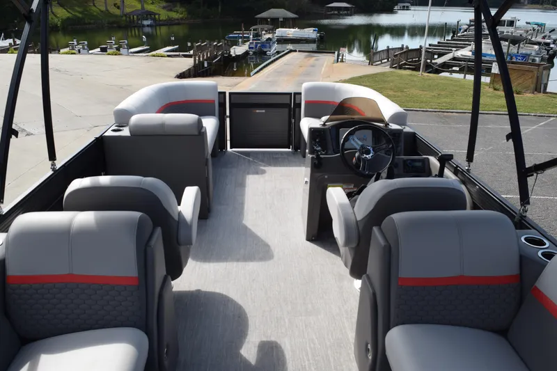 Slide: The Image of 2023 Qwest E Class-820 RLS-Lt pontoon boat interior with modern seating and steering wheel. - 6
