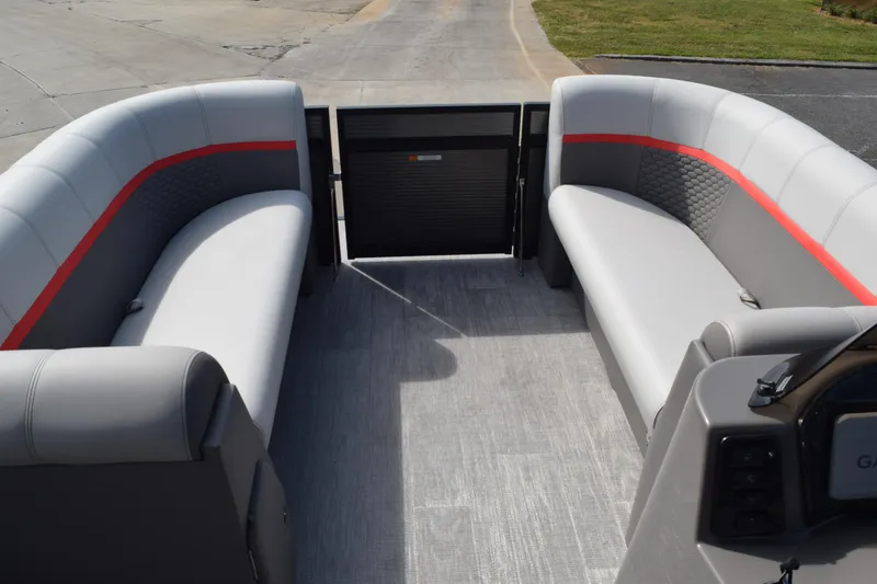 Slide: The Image of 2023 Qwest E Class-820 RLS-Lt pontoon boat interior with gray and red seating. - 7