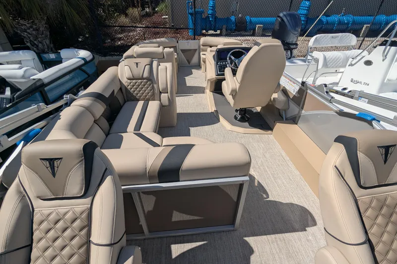 Slide: The Image of Luxurious interior of 2026 Trifecta 25 RFC SS pontoon boat with plush seating. - 5