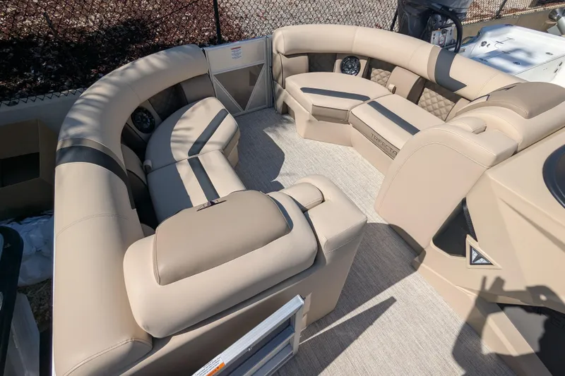 Slide: The Image of Luxurious seating on 2026 Trifecta 25 RFC SS pontoon boat, featuring beige upholstery. - 6