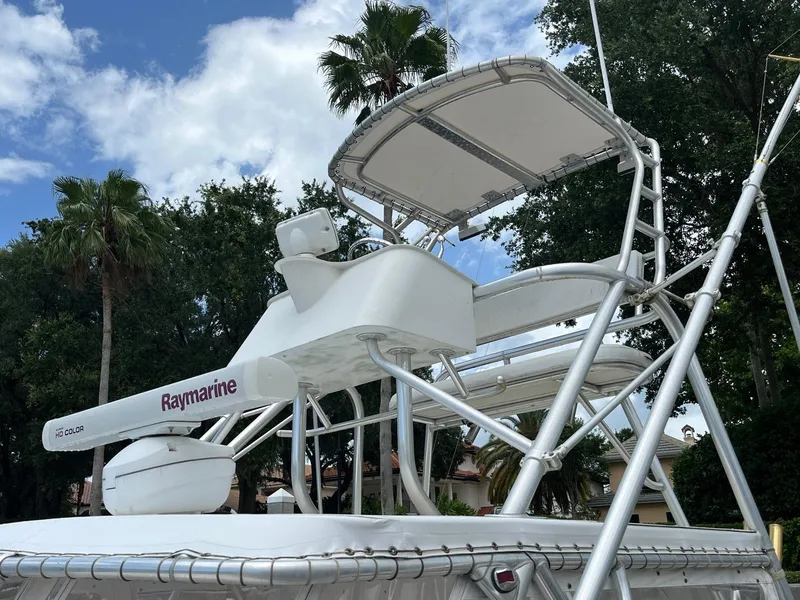 Slide: The Image of 2005 Strike 35 Sportfisherman boat with Raymarine equipment, featuring a tower and canopy. - 14