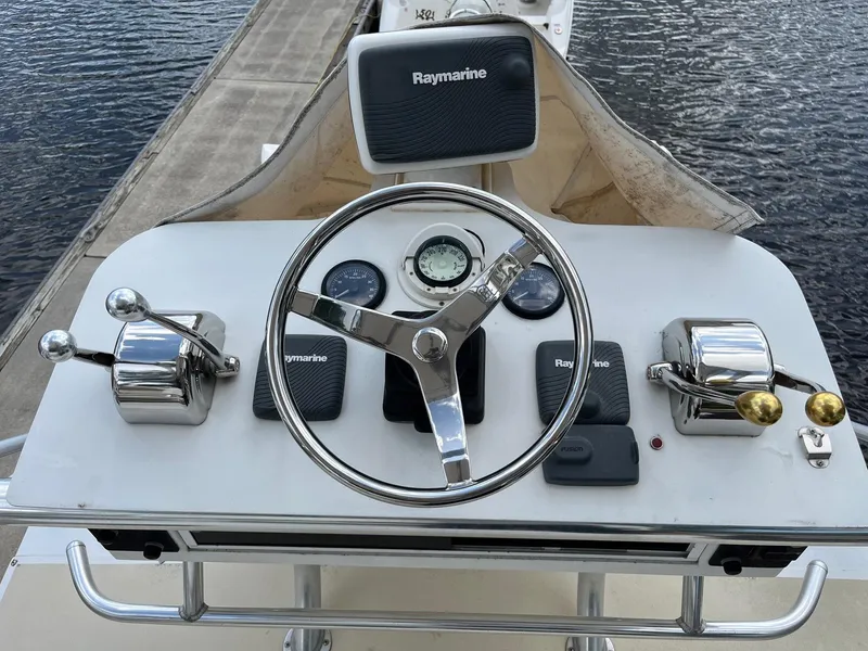 Slide: The Image of 2005 Strike 35 Sportfisherman helm with Raymarine electronics and dual throttle controls. - 15