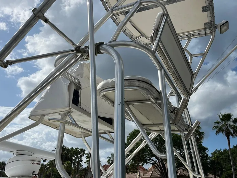 Slide: The Image of 2005 Strike 35 Sportfisherman boat tower with seating, under a cloudy sky. - 16