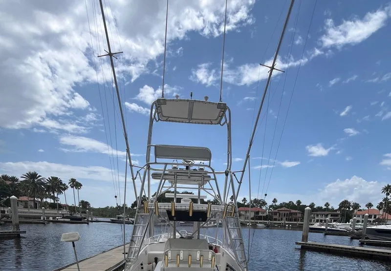 Slide: The Image of 2005 Strike 35 Sportfisherman docked at marina under blue sky. - 17