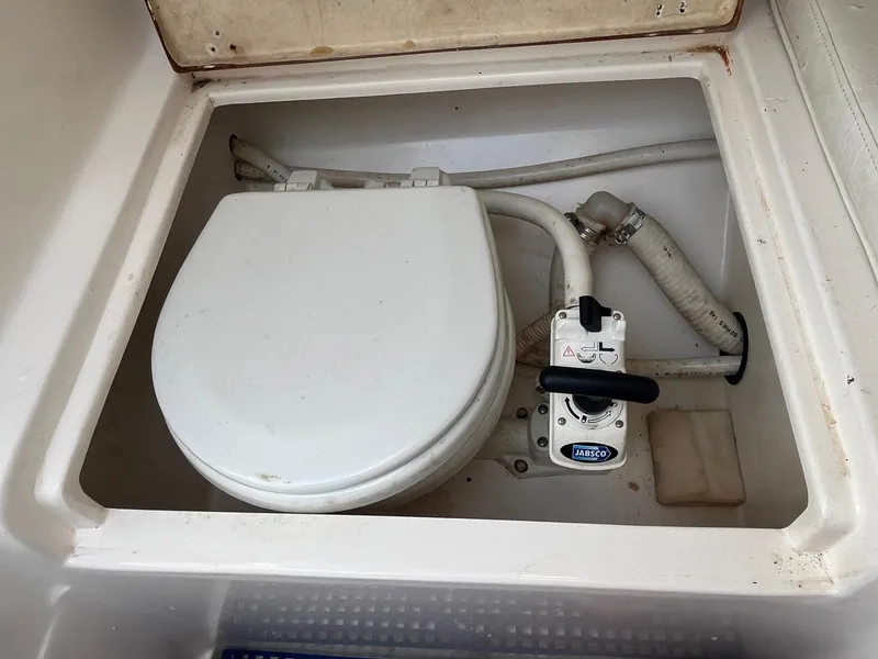 Slide: The Image of 2005 Strike 35 Sportfisherman marine toilet with manual pump system. - 6