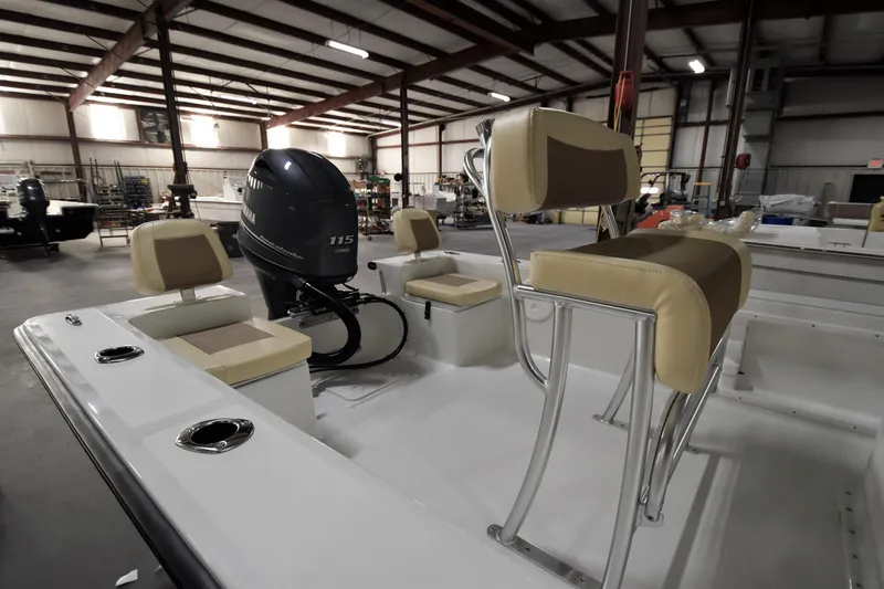 Slide: The Image of 2024 KenCraft 2060 Bay Rider Skiff interior with Yamaha 115 outboard motor in warehouse. - 15