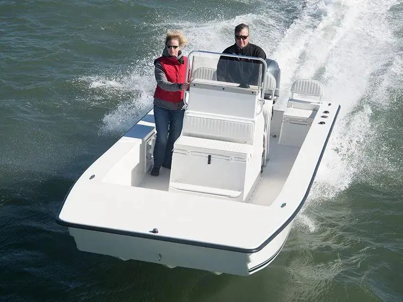 Slide: The Image of 2024 KenCraft 2060 Bay Rider Skiff cruising on water with two passengers. - 5