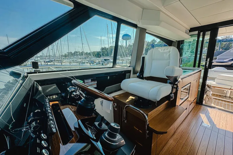 Slide: The Image of Interior of 2026 Tiara Yachts 43 LE, featuring helm station and luxurious seating. - 6