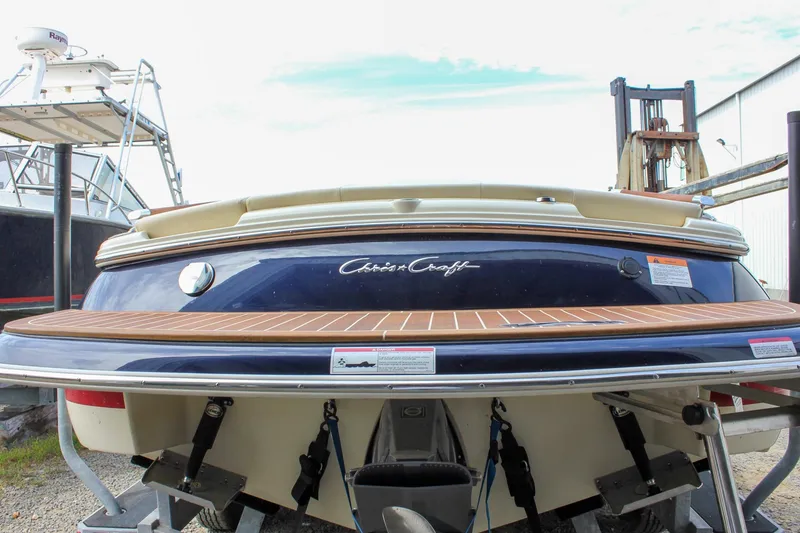 Slide: The Image of 2017 Chris-Craft Capri 27 boat side view with horn and windshield. - 18