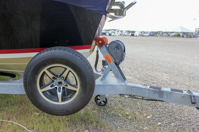 Slide: The Image of 2017 Chris-Craft Capri 27 boat on trailer, covered, parked outdoors. - 4