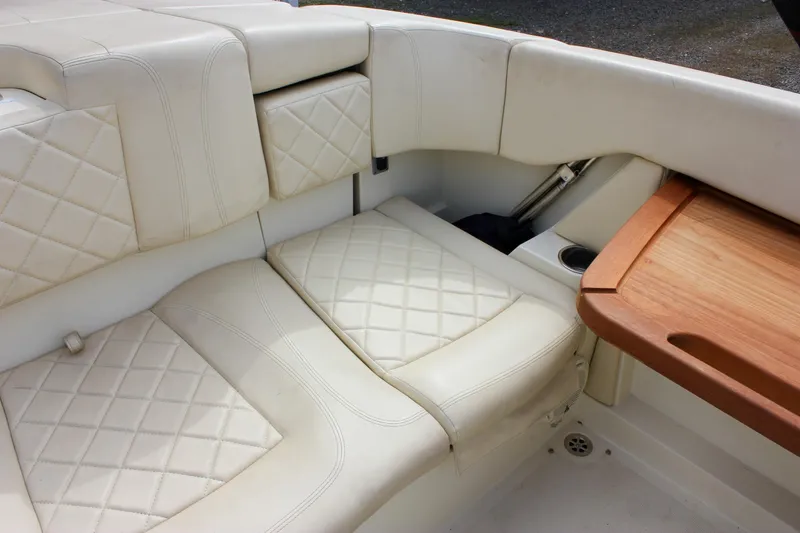 Slide: The Image of 2017 Chris-Craft Capri 27 interior with Volvo Penta control and capacity label. - 40