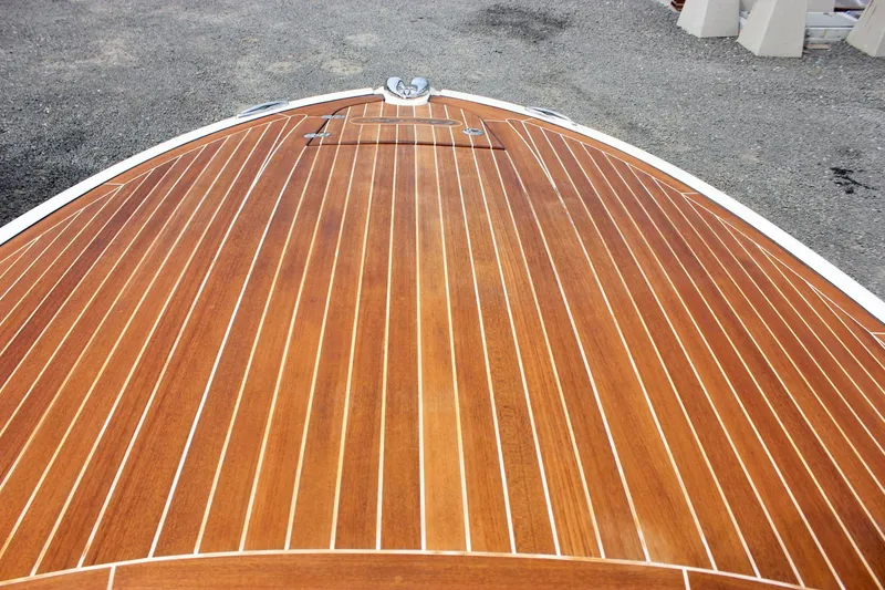 Slide: The Image of 2017 Chris-Craft Capri 27 boat interior with elegant wood accents and sleek design. - 52