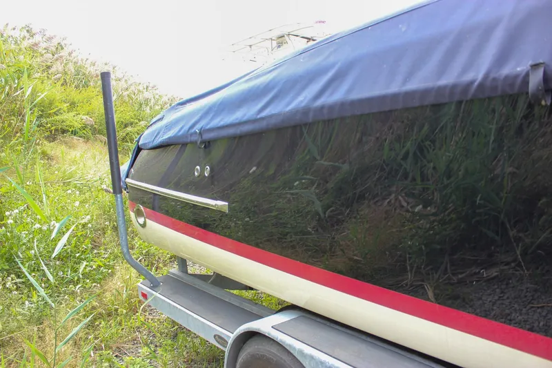 Slide: The Image of 2017 Chris-Craft Capri 27 boat on trailer, close-up of wheel and hitch. - 6