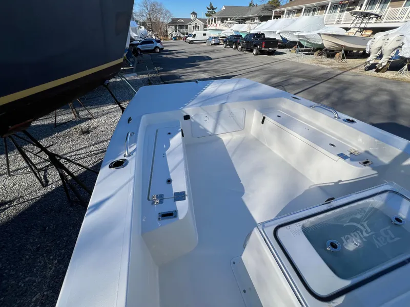 Slide: The Image of 2025 KenCraft 2260FS Bay Rider Skiff boat interior at a marina. - 4