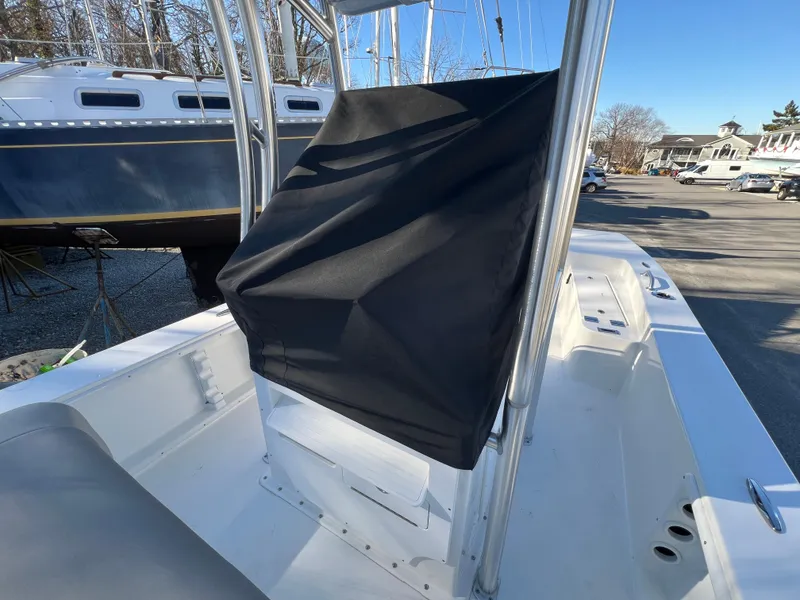 Slide: The Image of 2025 KenCraft 2260FS Bay Rider Skiff center console with black cover. - 6