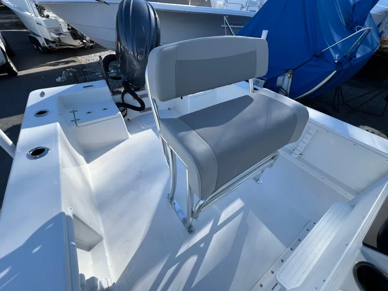 Slide: The Image of 2025 KenCraft 2260FS Bay Rider Skiff interior with seating and motor. - 8