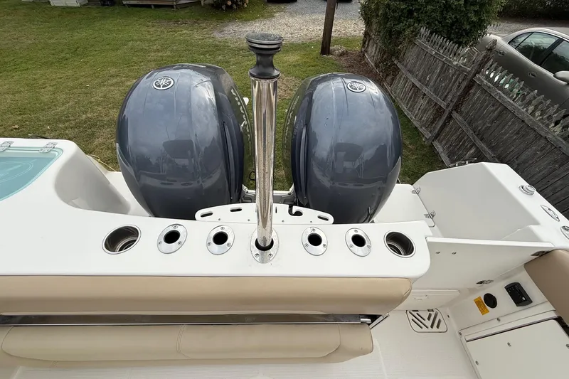 Slide: The Image of 2019 Sailfish 275 DC boat with dual Yamaha outboard motors, viewed from the deck. - 19